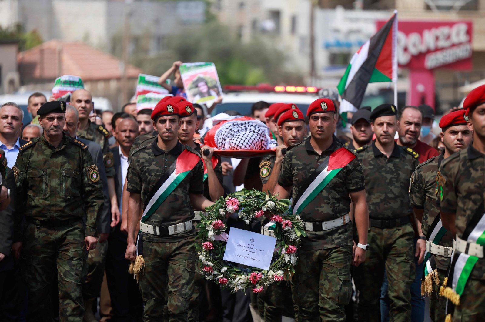 Members of Palestinian security forces carry the body of slain Turkish American International Solidarity Movement activist Ayşenur Ezgi Eygi during a funeral procession in Nablus, occupied West Bank, Palestine, Sept. 9, 2024. (AFP Photo)