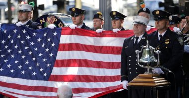 Members of the fire department and New York Port Authority Police Department hold a U.S. flag during a ceremony marking the 23rd anniversary of the Sept. 11, 2001 attacks on the World Trade Center in New York City, U.S., Sept. 11, 2024. (Reuters Photo)