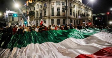 Judiciary workers and students hold a giant flag as they block the streets near the former headquarters of the Senate of Mexico, known as Casona de Xicotencatl, during a protest in Mexico City, Sept. 10, 2024. (AFP Photo)