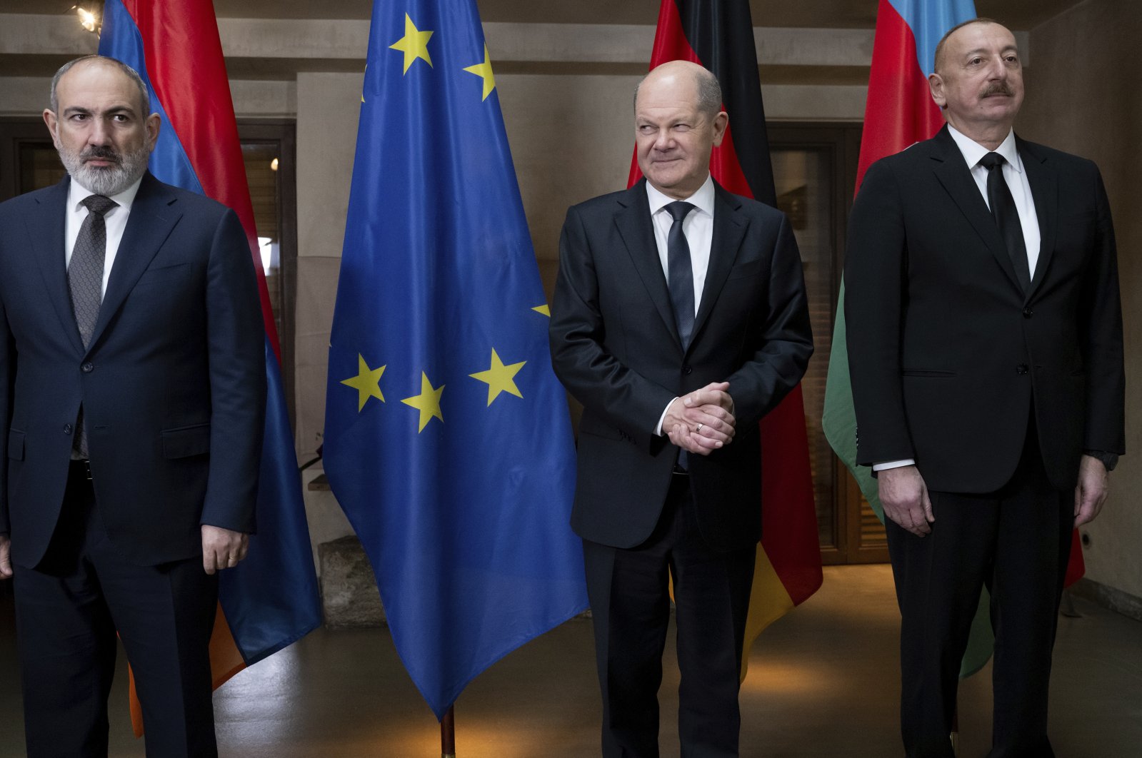 Armenian Prime Minister Nikol Pashinyan (L), German Chancellor Olaf Scholz (C) and Azerbaijani President Ilham Aliyev (R) line up for a photo during a meeting as part of the Munich Security Conference, Munich, Germany, Feb. 17, 2024. (AP Photo)