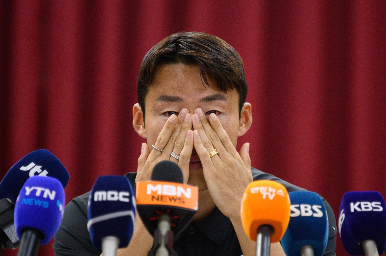 South Korean footballer Son Jun-ho wipes his eyes during a press conference at his K League club Suwon FC, Suwon, South Korea, Sept. 11, 2024. (AFP Photo)