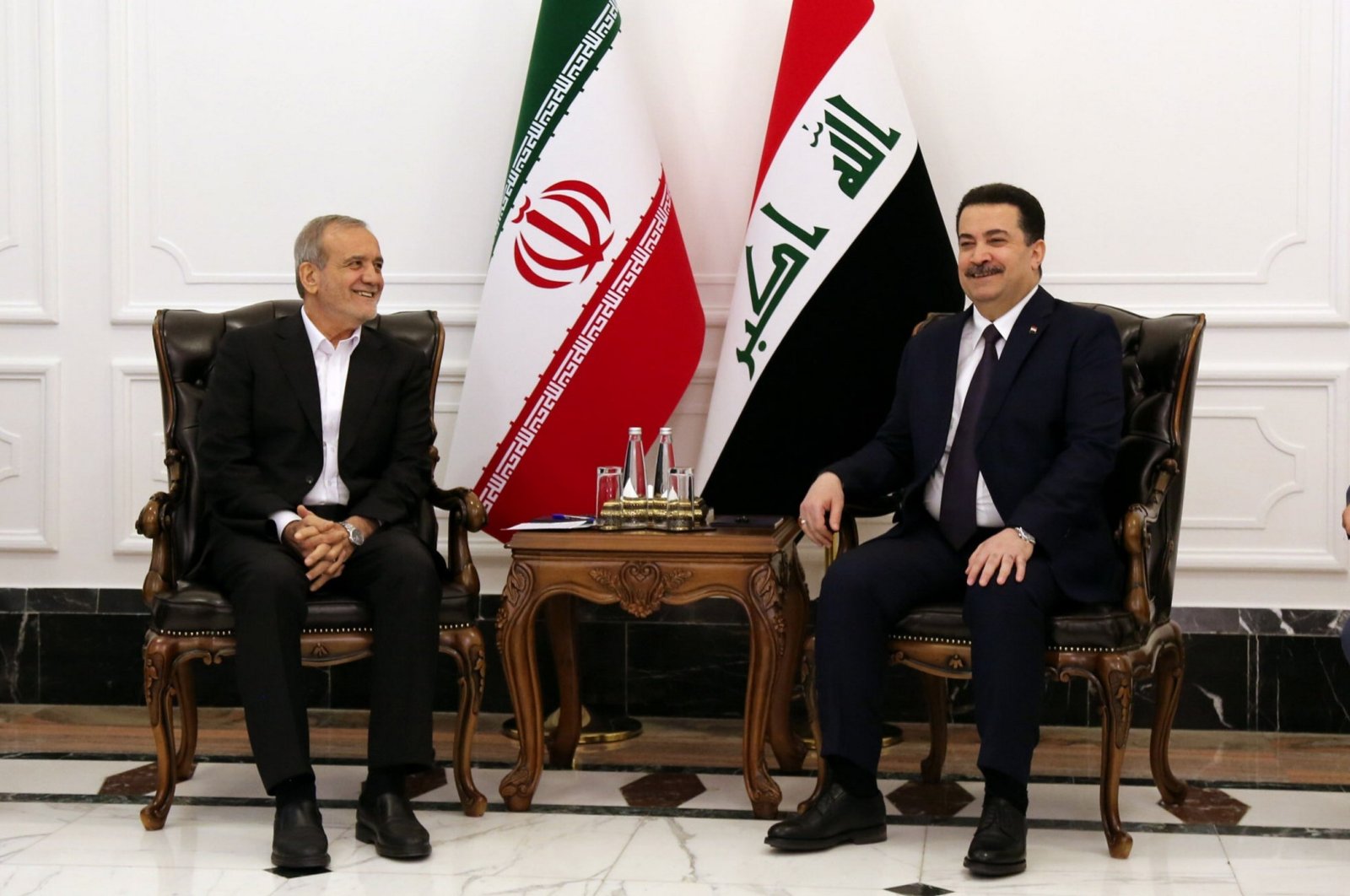 Iraqi Prime Minister Mohammed S. al-Sudani hosts Iranian President Masoud Pezeshkian (L) in Baghdad, Iraq, Sept. 11, 2024.