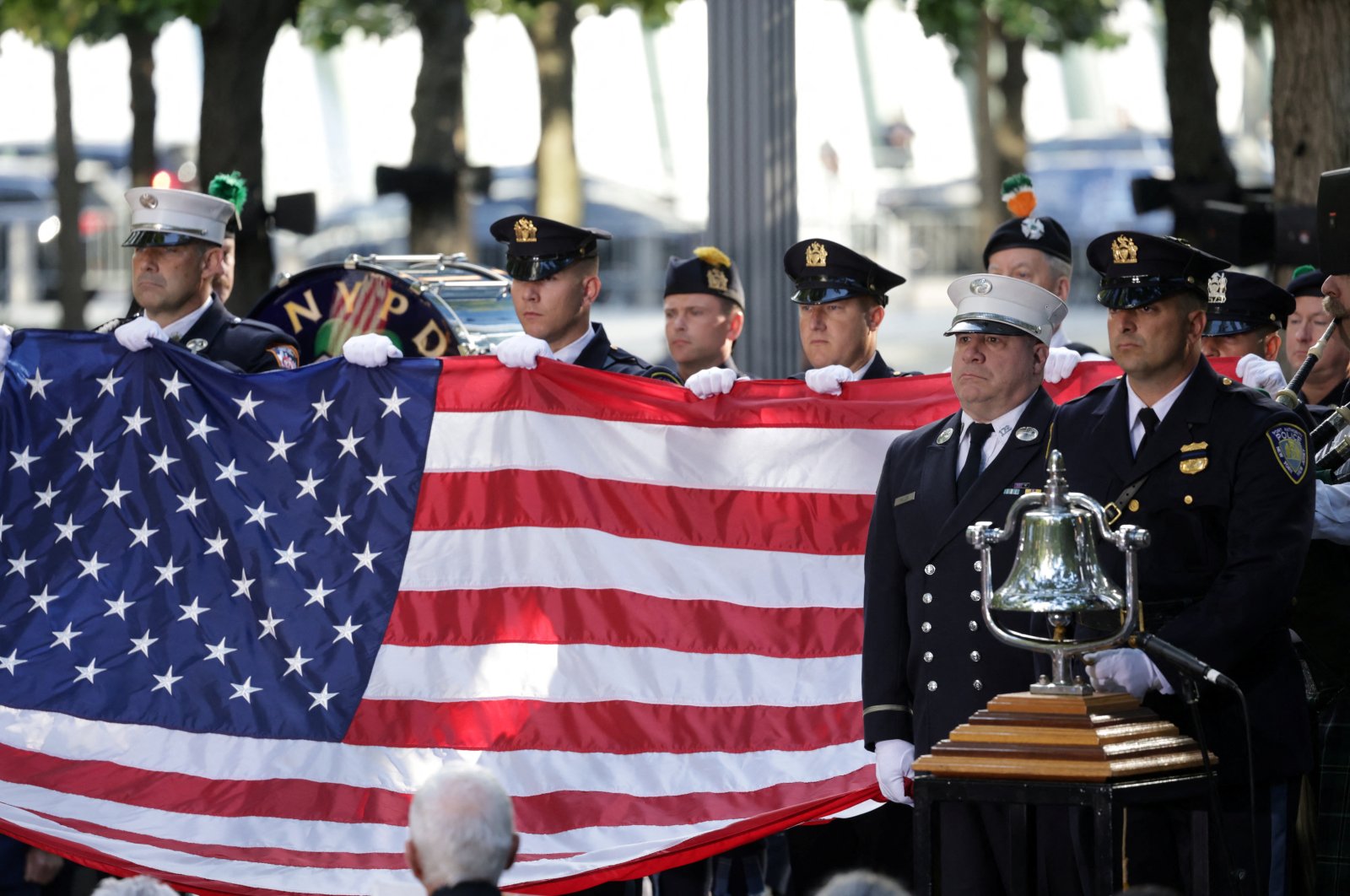 Members of the fire department and New York Port Authority Police Department hold a U.S. flag during a ceremony marking the 23rd anniversary of the Sept. 11, 2001 attacks on the World Trade Center in New York City, U.S., Sept. 11, 2024. (Reuters Photo)