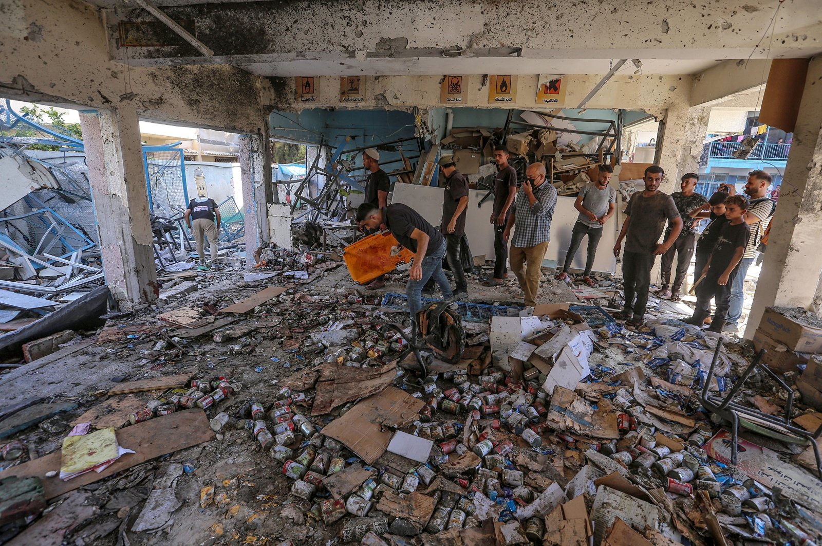 Palestinians search for missing people under the rubble of UNRWA-run school, which was turned-shelter known as al-Jaouni, following an Israeli air strike in Al-Nuseirat refugee camp, central Gaza Strip, Sept. 11, 2024. (EPA Photo)