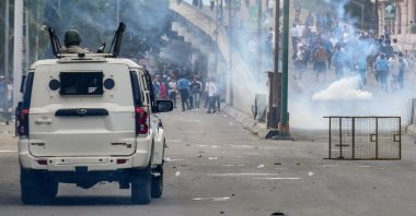 Security personnel fire tear gas shells to disperse protesters during a curfew in Imphal, Manipur, northeastern India, Sept. 10, 2024. (AFP Photo)
