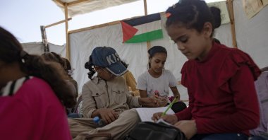 Palestinian children sit in a makeshift school classroom inside a tent, Khan Younis, Gaza Strip, Sept. 12, 2024. (EPA Photo)