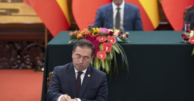 Spain's Minister of Foreign Affairs Jose Manuel Albares signs an agreement in the presence of Spanish Prime Minister Pedro Sanchez at the Great Hall of the People in Beijing, China, Sept. 9, 2024. (EPA Photo)
