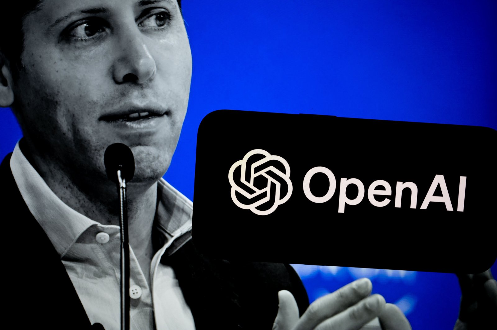 The logo of OpenAI is seen on a screen with the backdrop of its CEO Sam Altman in this illustration taken Aug. 13, 2024. (AA Photo)