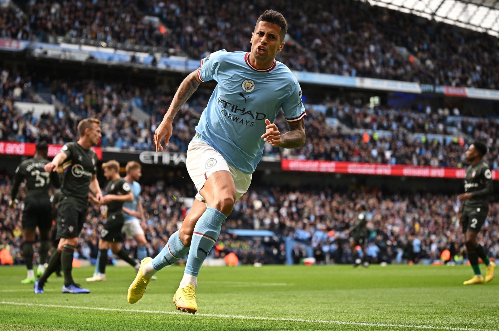 Joao Cancelo celebrates scoring the opening goal during the English Premier League football match between Manchester City and Southampton at the Etihad Stadium, Manchester, U.K., Oct. 8, 2022. (AFP Photo)