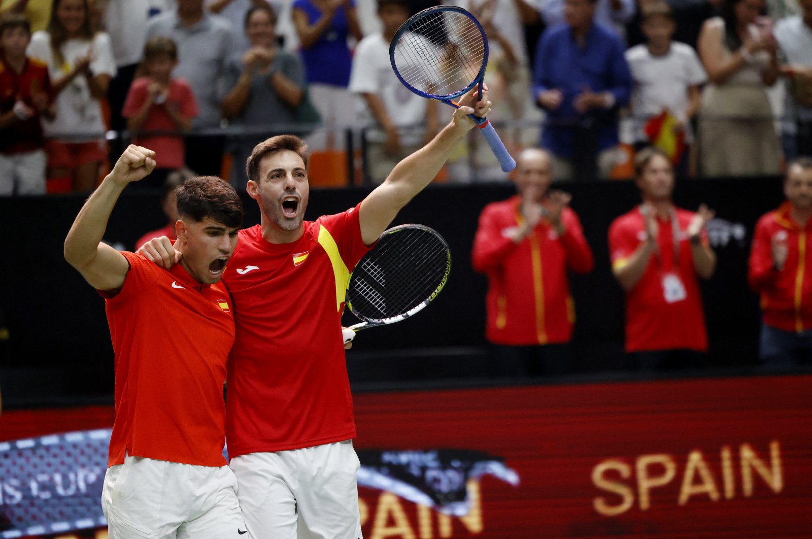 Spain&#039;s Carlos Alcaraz (L) and Marcel Granollers celebrate winning their Davis Cup doubles match against Czechia&#039;s Jakub Mensik and Adam Pavlasek at the Pabellon Fuente de San Luis, Valencia, Spain, Sept. 11, 2024. (Reuters Photo)