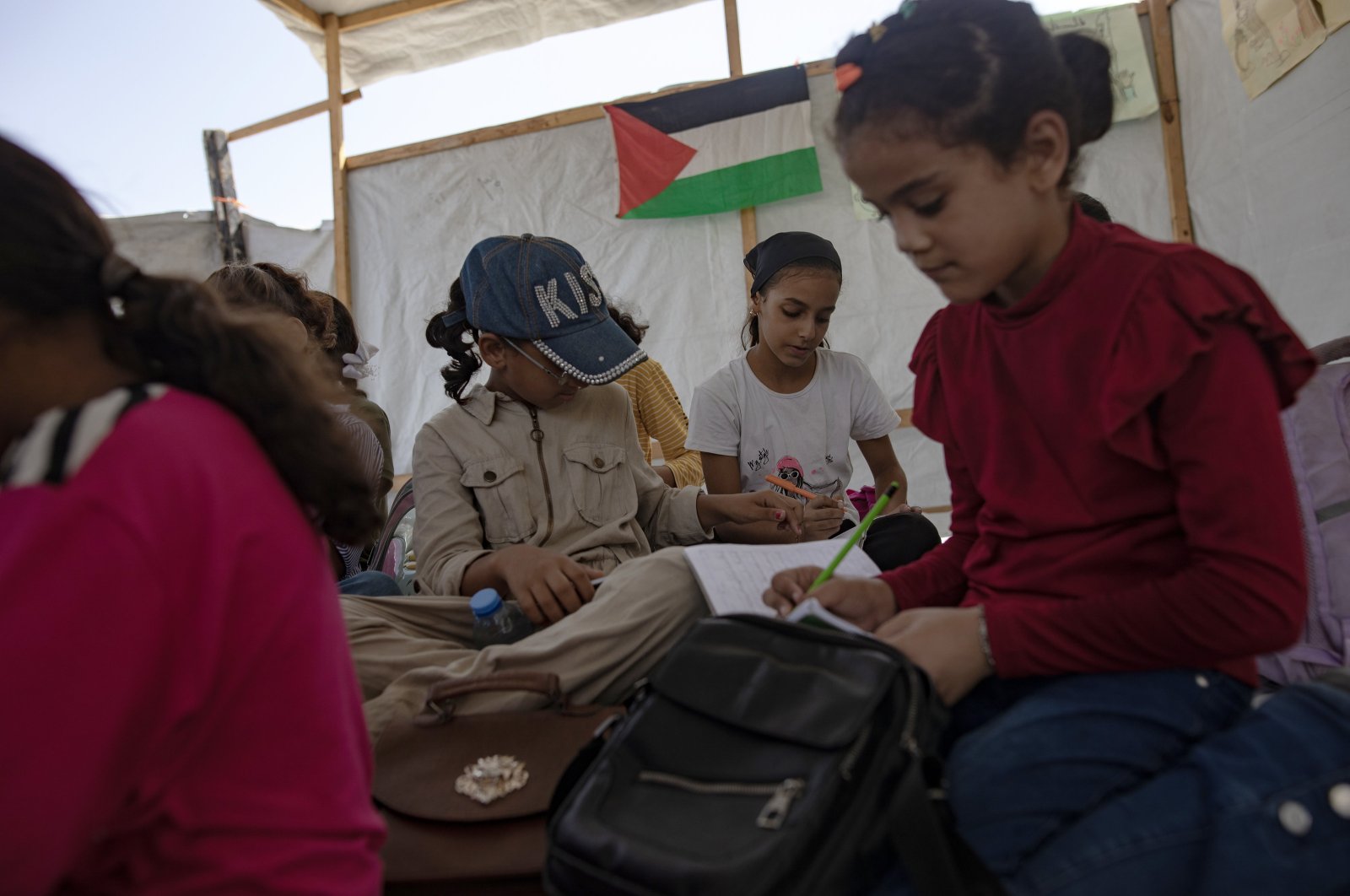 Palestinian children sit in a makeshift school classroom inside a tent, Khan Younis, Gaza Strip, Sept. 12, 2024. (EPA Photo)