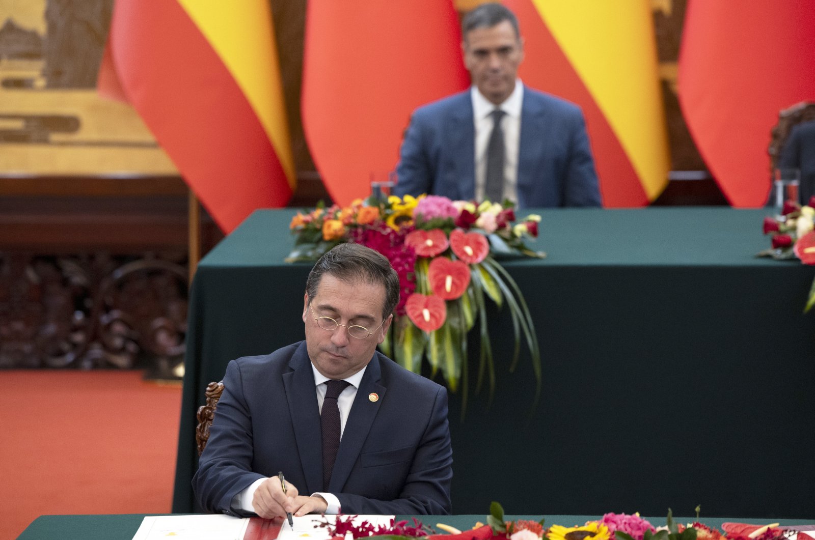 Spain&#039;s Minister of Foreign Affairs Jose Manuel Albares signs an agreement in the presence of Spanish Prime Minister Pedro Sanchez at the Great Hall of the People in Beijing, China, Sept. 9, 2024. (EPA Photo)