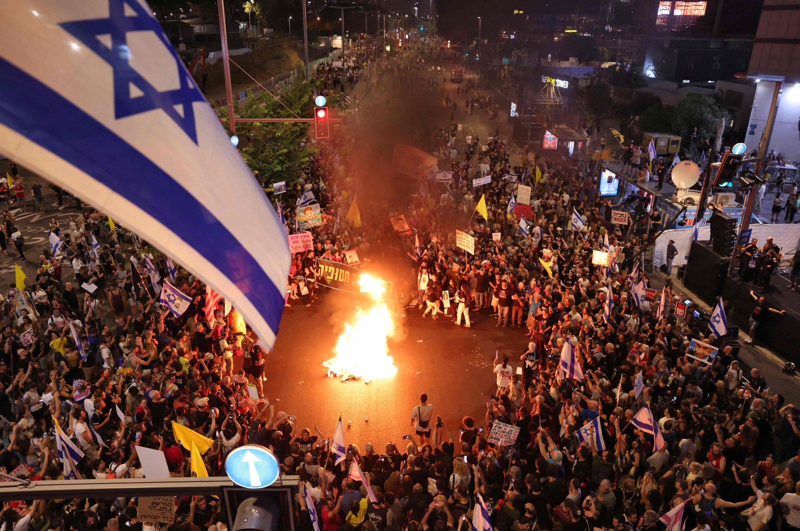 Demonstrators set a fire during an anti-government protest calling for action to secure the release of Israeli hostages held captive since Oct. 7, in front of the Israeli Defense Ministry in Tel Aviv on Sept. 7, 2024. (AFP Photo)