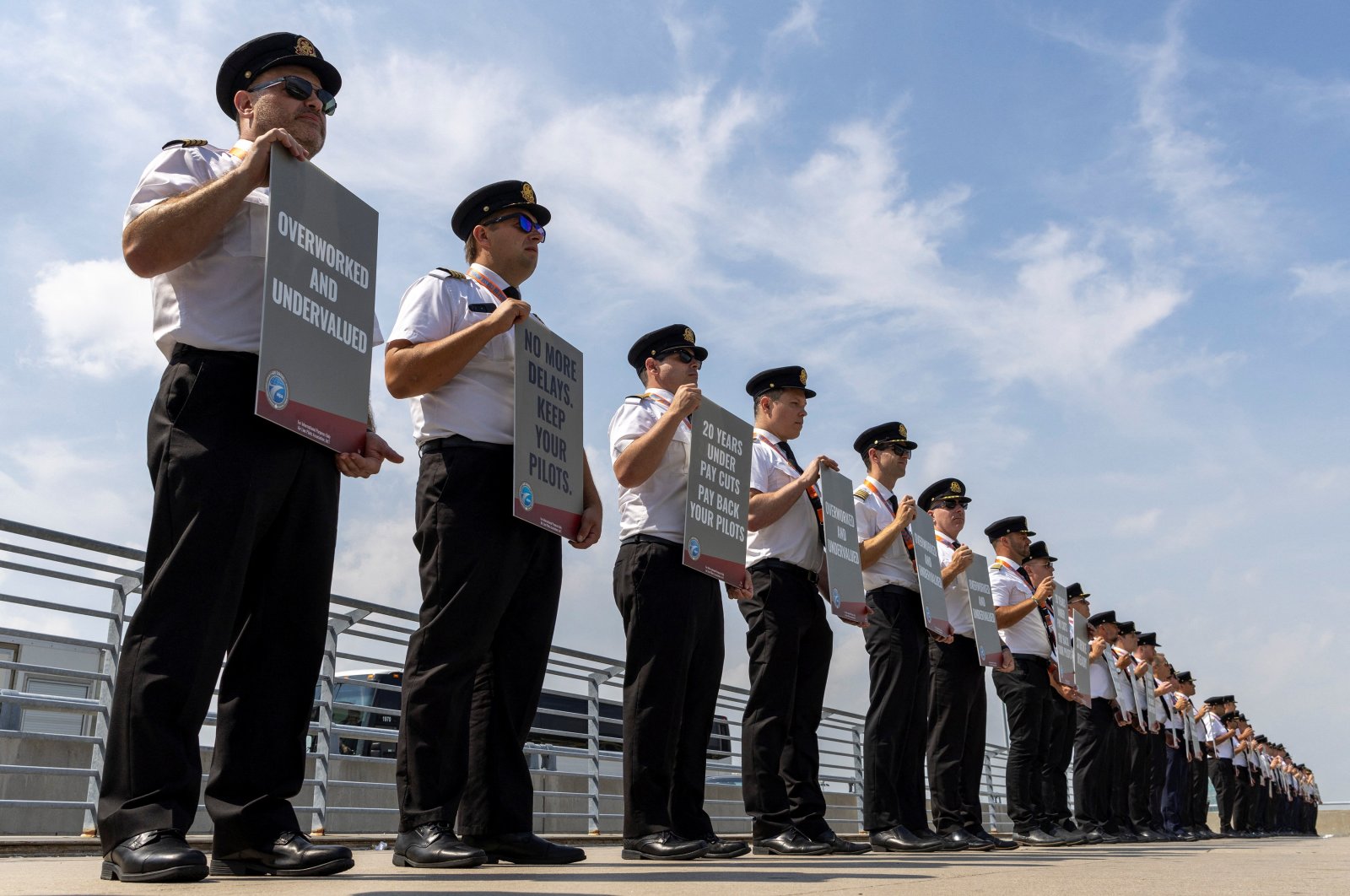 Air Canada pilots represented by the Air Line Pilots Association, Int’l (ALPA), who voted to authorize a strike, hold an informational picket at Toronto Pearson International Airport in Mississauga, Ontario, Canada, Aug. 27, 2024. (Reuters Photo)