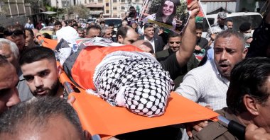 Palestinian people carry the body of slain Turkish American activist Ayşenur Ezgi Eygi, covered with a chequered keffiyeh and the Palestinian flag, during a memorial service, in the occupied West Bank, Palestine, Sept. 9, 2024. (AA Photo)