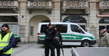 German police document some PKK flags and banners during a pro-PKK demonstration in Munich, Germany, Feb. 10, 2018. (Getty Images Photo)