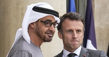 UAE President Sheikh Mohammed bin Zayed Al Nahyan (L) and French President Emmanuel Macron pose for photographers ahead of their working dinner at the Elysee Palace, Paris, France, May 11, 2023. (AP Photo)