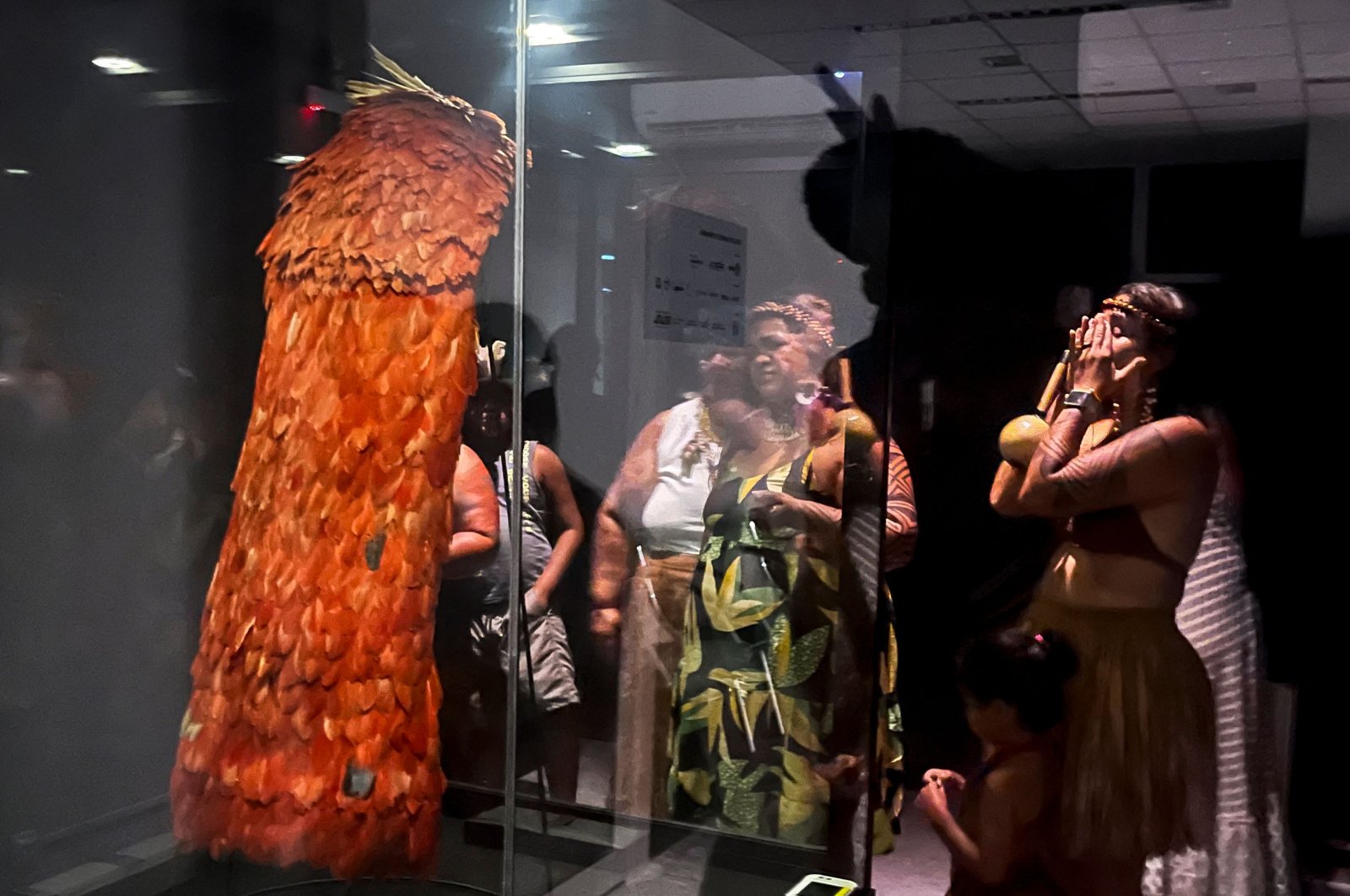 Members of the Tupinamba Indigenous people visit the Tupinamba cloak returned by the National Museum of Denmark at the Quinta de Boa Vista Park, Rio de Janeiro, Brazil, Sept. 11, 2024. (AFP Photo)