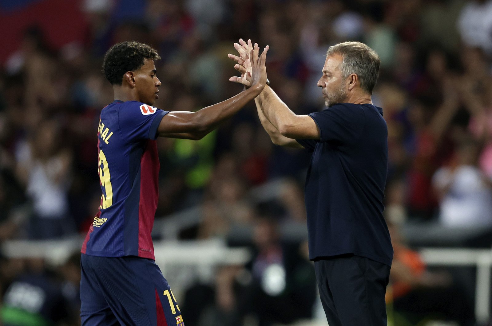 Barcelona&#039;s Lamine Yamal (L) and coach Hansi Flick during the La Liga match against Athletic Bilbao at the Lluis Companys Olympic Stadium, Barcelona, Spain, Aug. 24, 2024. (Getty Images Photo)