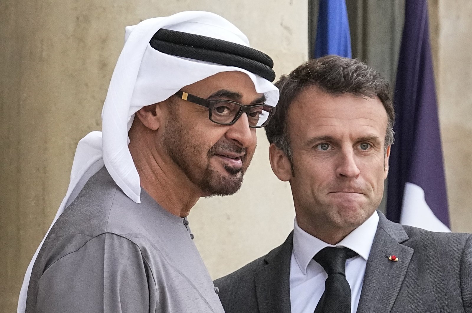 UAE President Sheikh Mohammed bin Zayed Al Nahyan (L) and French President Emmanuel Macron pose for photographers ahead of their working dinner at the Elysee Palace, Paris, France, May 11, 2023. (AP Photo)