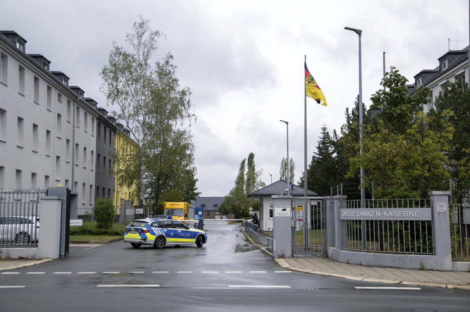 A police car drives on the grounds of the Upper Franconia barracks, in Hof, Germany in this undated photo. (Pia Bayer/dpa via AP)