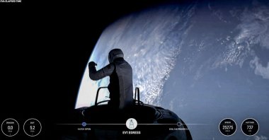 This still image taken from a SpaceX and Polaris broadcast shows U.S. fintech billionaire Jared Isaacman (EV1) peeking out to space from a hatch structure called &quot;Skywalker&quot; during the first private spacewalk performed by the crew of the SpaceX Polaris Dawn mission, Sept. 12, 2024. (AFP Photo)