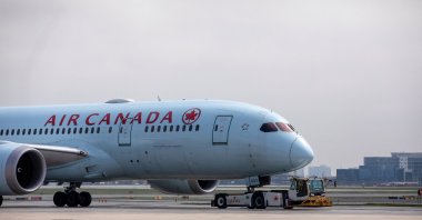 An Air Canada airplane is towed along a runway at Toronto Pearson Airport in Mississauga, Ontario, Canada, April 28, 2021. (Reuters Photo)