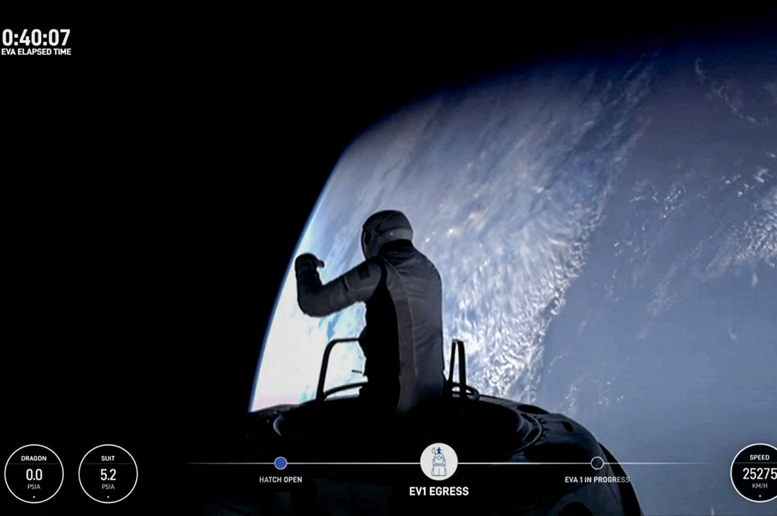 This still image taken from a SpaceX and Polaris broadcast shows U.S. fintech billionaire Jared Isaacman (EV1) peeking out to space from a hatch structure called &quot;Skywalker&quot; during the first private spacewalk performed by the crew of the SpaceX Polaris Dawn mission, Sept. 12, 2024. (AFP Photo)