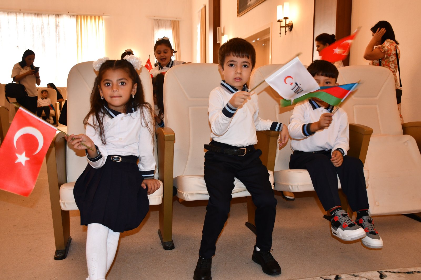 Students proudly display the flags of Türkiye, Azerbaijan and TIKA, Göygöl, Azerbaijan, Sept. 15, 2024. (AA Photo)