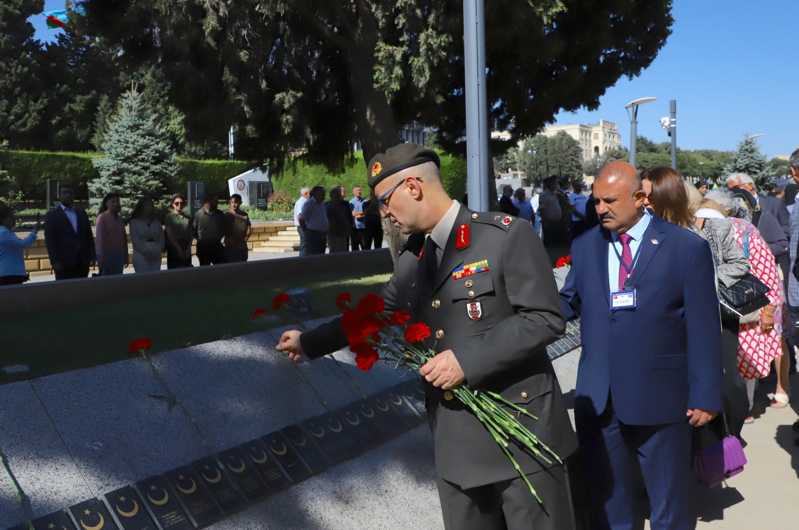 People lay flowers at Baku Turkish Martyrs Cemetery, Baku, Azerbaijan, Sept. 15, 2024. (AA Photo)