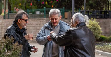 Old men drinking tea while chit-chatting, Istanbul, Türkiye, Feb. 24, 2024. (Getty Images Photo)