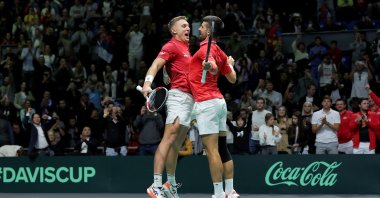 Serbia's Novak Djokovic (R) and Hamad Medjedovic celebrate after winning against Greece's Petros Tsitsipas and Aristotelis Thanos during the group stage men's doubles match between Serbia and Greece of the Davis Cup tennis tournament at the Aleksandar Nikolic Hall, Belgrade, Serbia, Sept. 15, 2024. (AFP Photo)
