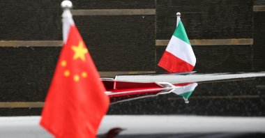 The flags of Italy and China adorn a car outside the venue where Italian Prime Minister Giorgia Meloni spoke to members of the media, Beijing, China, July 30, 2024. (Reuters Photo)
