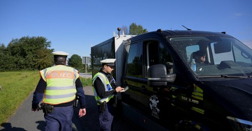 German police officers check a vehicle at a border with Denmark, as all German land borders are subject to random controls, Boeglum, Germany, Sept. 16, 2024. (Reuters Photo)