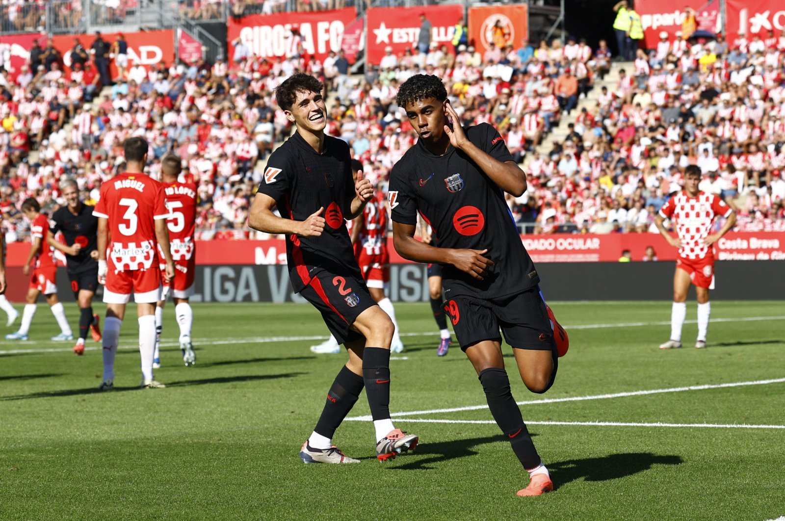 Barcelona&#039;s Lamine Yamal (R) celebrates scoring their second goal with Pau Cubarsi during the La Liga match against Girona at the Estadi Montilivi, Girona, Spain, Sept. 15, 2024. (Reuters Photo) 