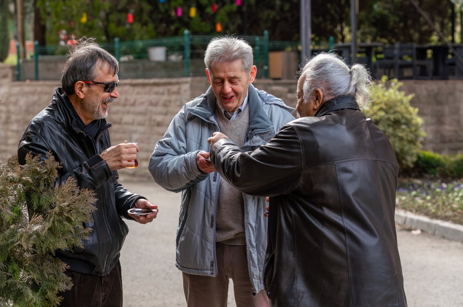 Old men drinking tea while chit-chatting, Istanbul, Türkiye, Feb. 24, 2024. (Getty Images Photo)