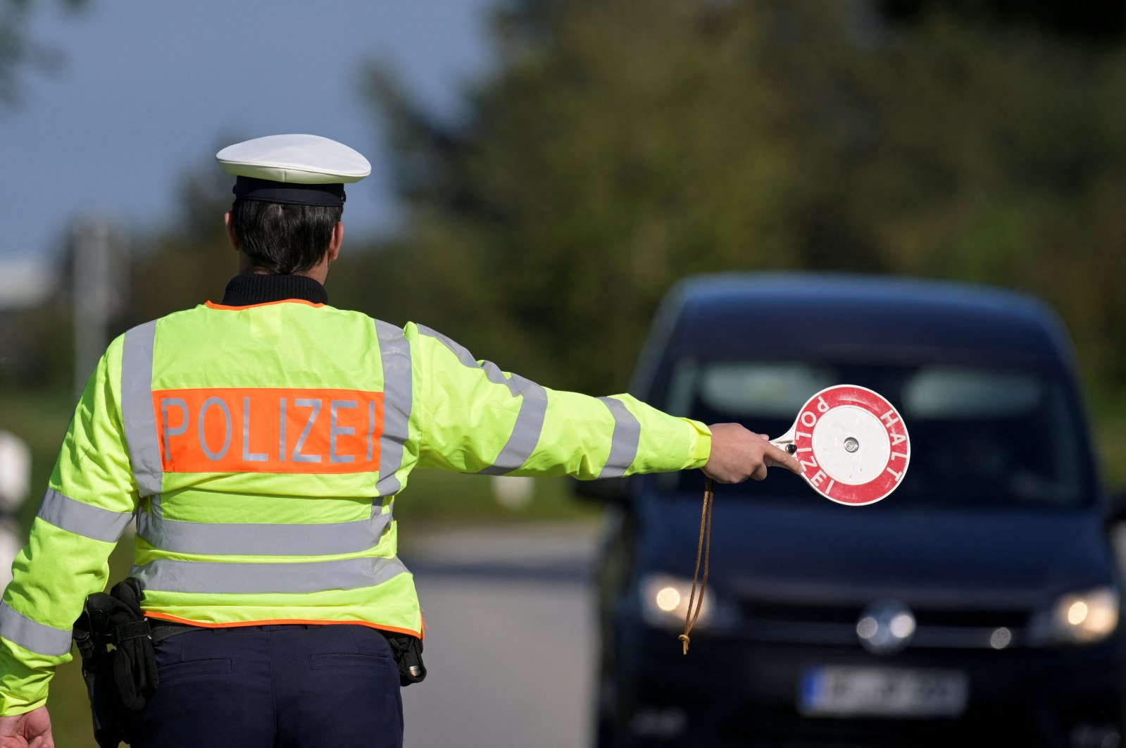 A German police officer stops a vehicle at a border with Denmark as part of random controls in Boeglum, Germany, Sept. 16, 2024. (Reuters Photo)