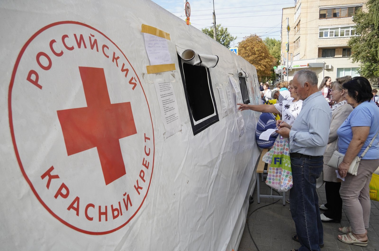 Civilians evacuated from the Kursk regional border area with Ukraine, wait to receive humanitarian aid and medical care delivered by the Russian Red Cross in downtown Kursk, Russia, Sept. 10, 2024. (EPA Photo)