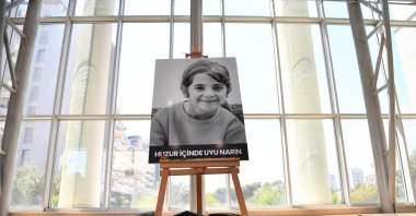 A photo of 8-year-old Narin Güran is displayed during a memorial ceremony in Antalya, Türkiye, Sept. 9, 2024. (AA Photo)