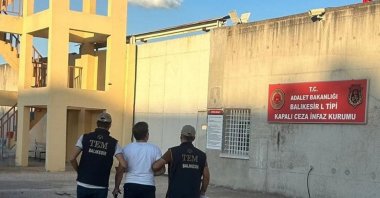 Police escort a wanted FETÖ terrorist to a prison in the western Balıkesir province, Türkiye, Sept. 16, 2024. (AA Photo)