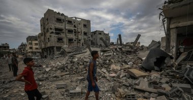 Palestinians search among the rubble of a destroyed house following Israeli airstrikes in the al-Bureij refugee camp in the southern Gaza Strip, Palestine, Sept. 17, 2024. (EPA Photo)