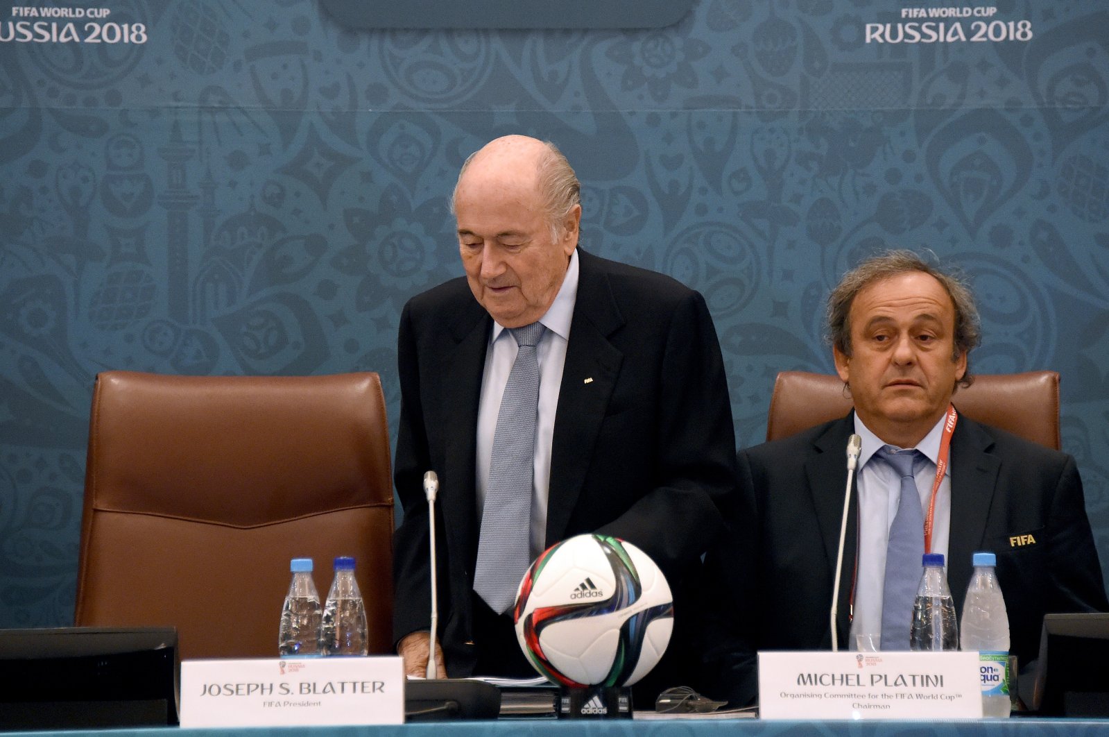 Joseph Blatter (L) takes a seat next to Michel Platini as they join a seminar ahead of the Preliminary Draw for the FIFA World Cup 2018, St. Petersburg, Russia, July 25, 2015. (Getty Images Photo)