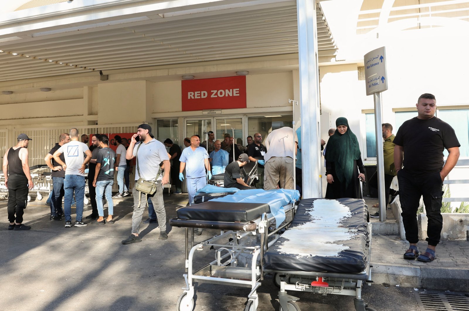 People gather outside a hospital, as hundreds of members of the Lebanese armed group Hezbollah, including fighters and medics, were seriously wounded on Tuesday when the pagers they use to communicate exploded, according to a security source, in Beirut, Lebanon Sept. 17, 2024. (Reuters Photo)