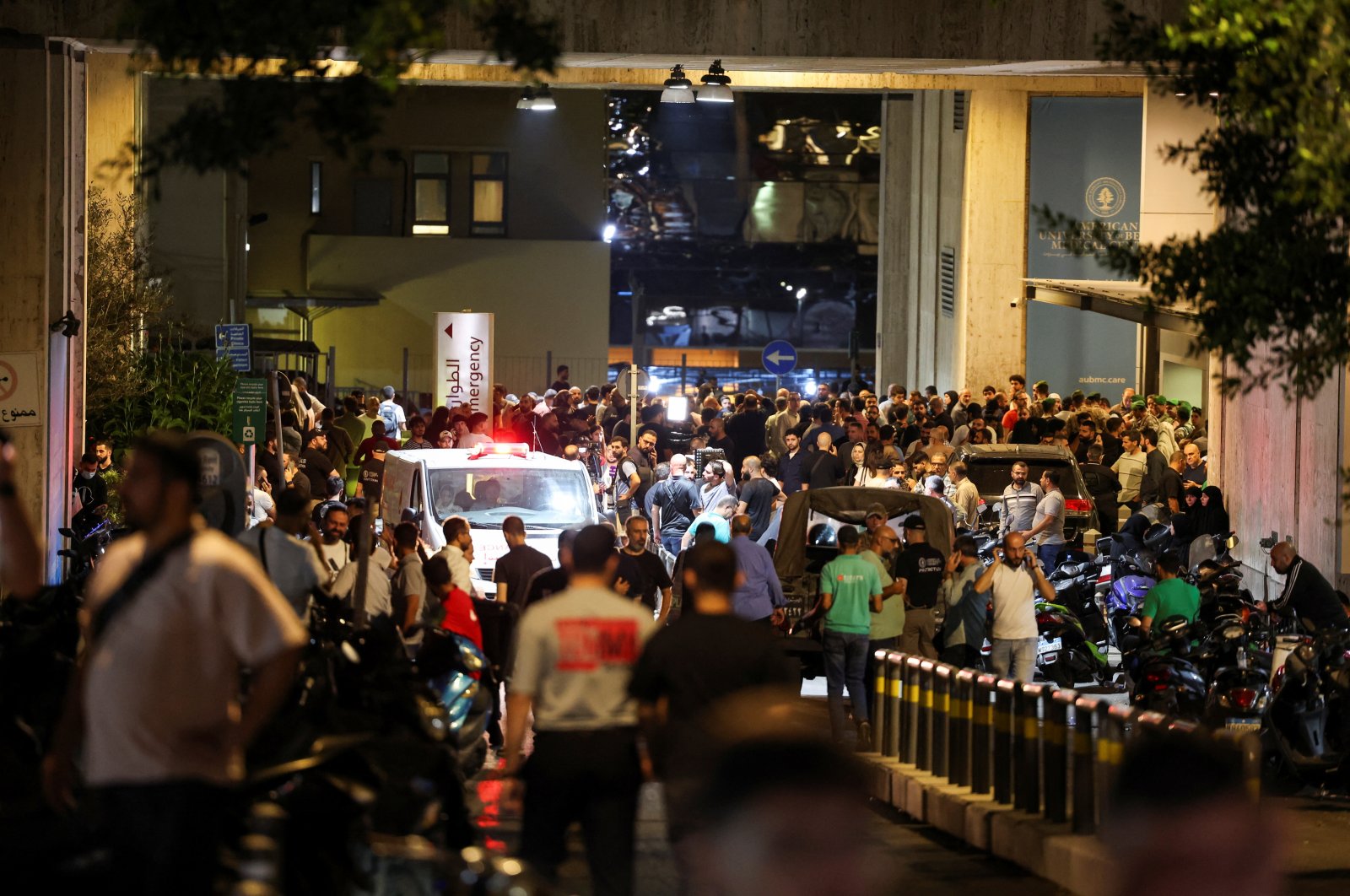 People gather outside American University of Beirut Medical Center (AUBMC) as more than 1,000 people, including medics, were wounded when the pagers they use to communicate exploded across Lebanon, in Beirut, Sept. 17, 2024. (Reuters Photo)