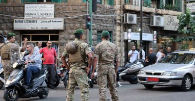 Lebanese army soldiers stand guard near a hospital (not pictured) after explosions hit locations in several Hezbollah strongholds around Lebanon, Beirut, Lebanon, Sept. 17, 2024. (AFP Photo)