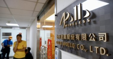 People wait outside the office of the Taiwanese company "Gold Apollo" in New Taipei City, Taiwan, Sept. 18, 2024. (EPA Photo)