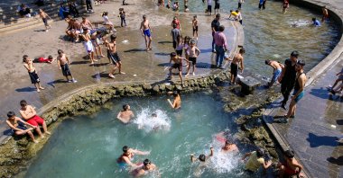 Children cool off in decorative fountains amid the extreme heat in Diyarbakır, Türkiye, May 22, 2024. (AA Photo)