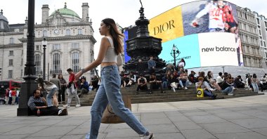 A shopper walks in Piccadilly Circus in London, Britain, Sept. 2, 2024. (Reuters Photo)