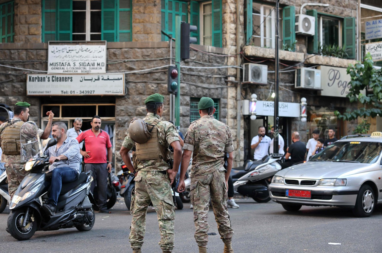 Lebanese army soldiers stand guard near a hospital (not pictured) after explosions hit locations in several Hezbollah strongholds around Lebanon, Beirut, Lebanon, Sept. 17, 2024. (AFP Photo)