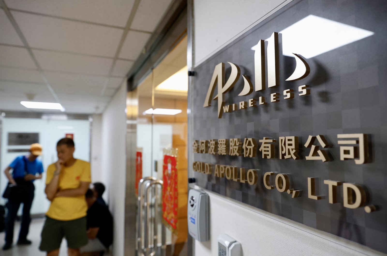 People wait outside the office of the Taiwanese company "Gold Apollo" in New Taipei City, Taiwan, Sept. 18, 2024. (EPA Photo)